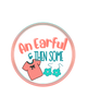 A circular logo or sticker design on a white background with the text 'An Earful & THEN SOME' in coral and teal lettering, plus small illustrations of a coral T-shirt and teal flower earrings.